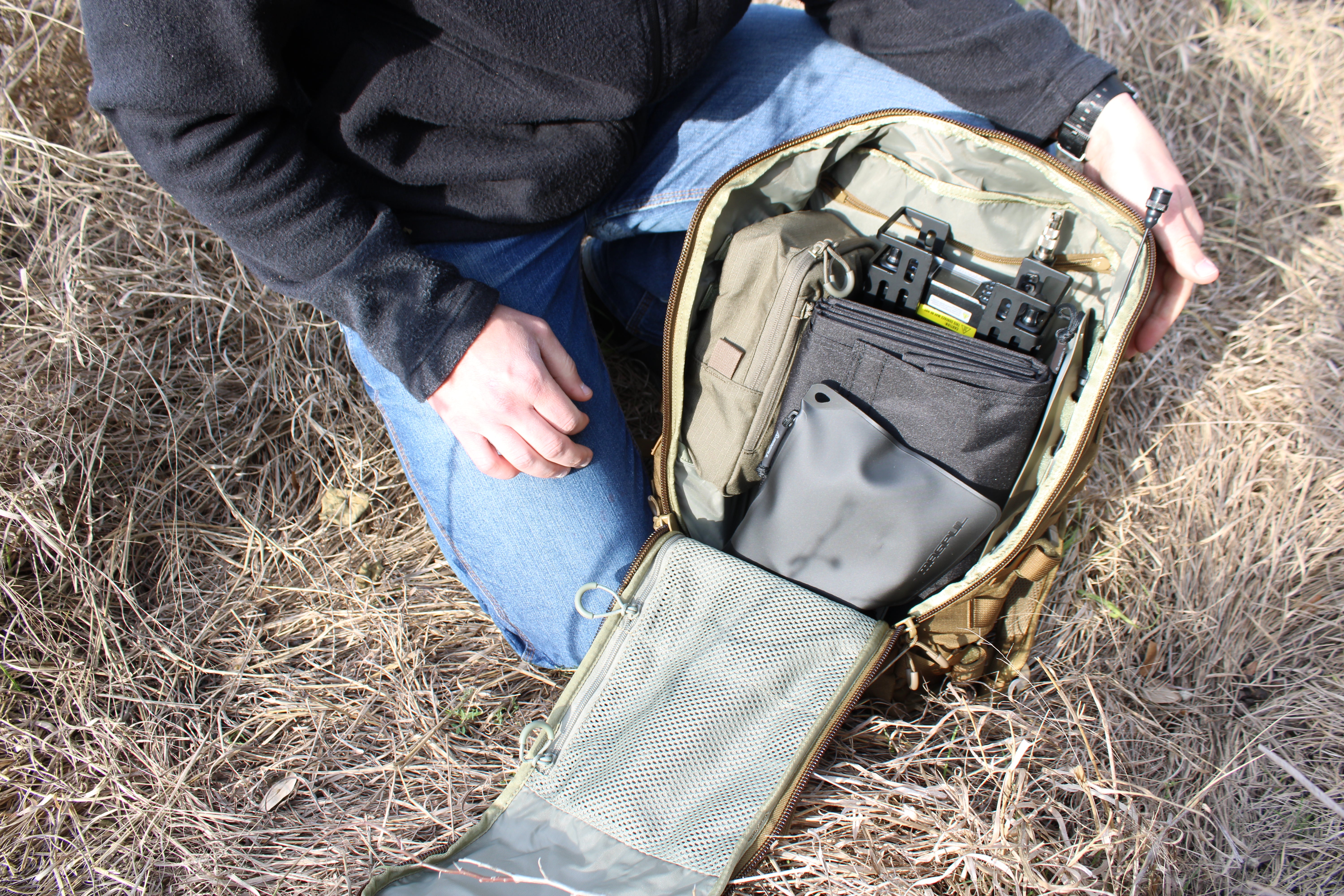 UHF/VHF Emergency Radio Kit with mobile and handheld radios, solar panel, lithium batteries, and Eberlestock Mission Assault Pack