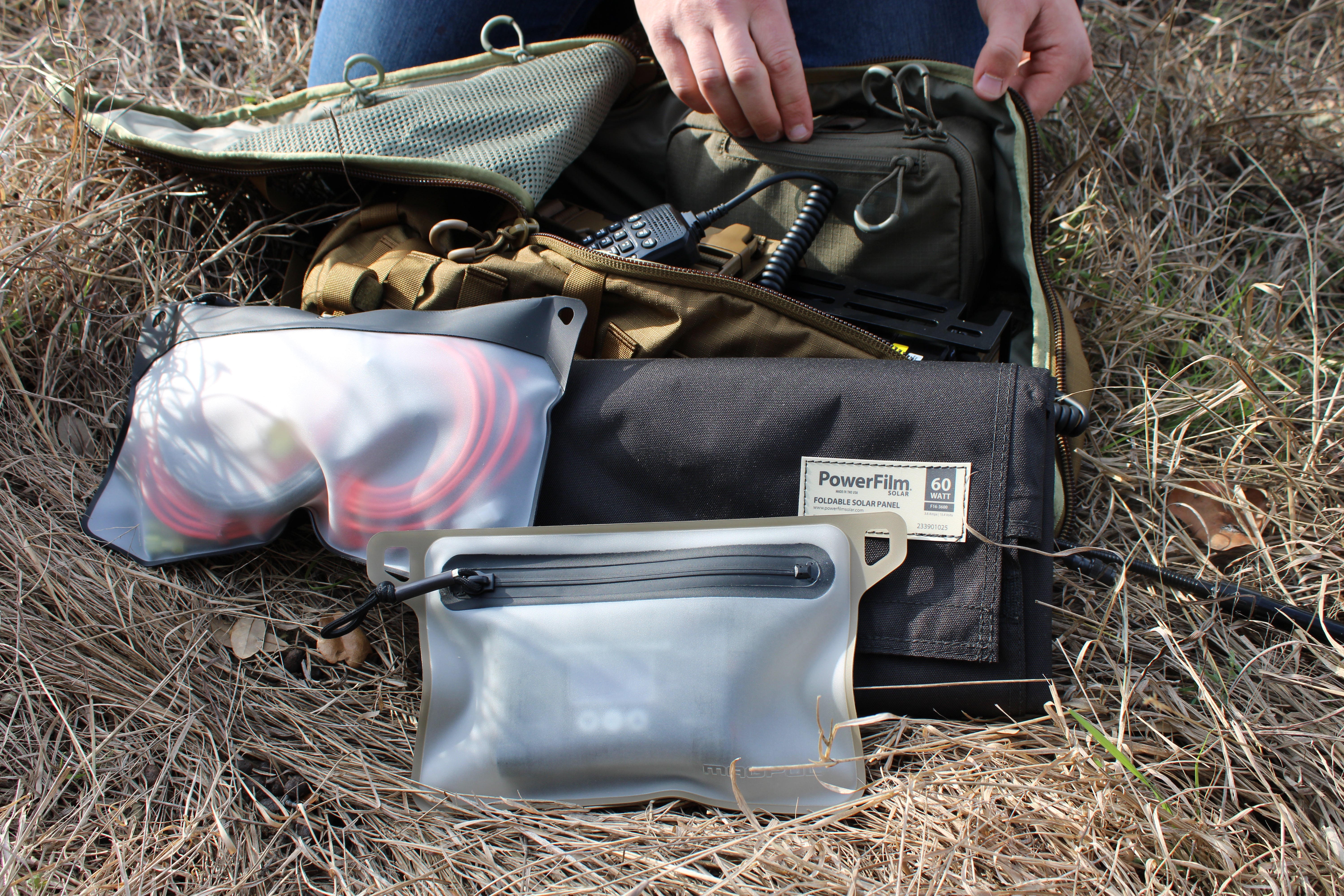 UHF/VHF Emergency Radio Kit with mobile and handheld radios, solar panel, lithium batteries, and Eberlestock Mission Assault Pack